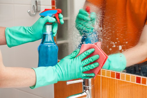 Cleaner checking a carpeted area for safety after treatment