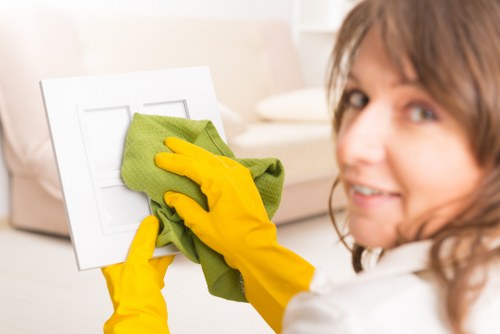 Technician using protective measures during carpet cleaning