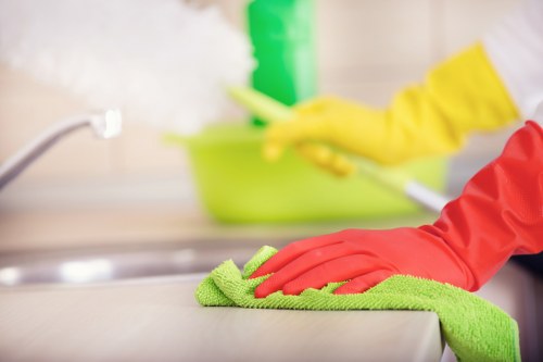 Staff member wearing PPE during carpet cleaning in SE1
